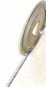 Beveled edged blade for concrete saws gives a nicer finish to a decorative saw cut.