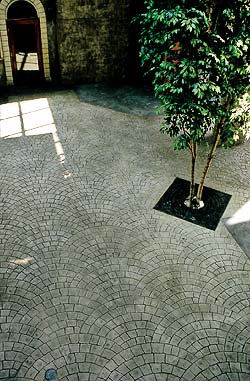 Bomanite contractor Ira Goldber shows off his stamped concrete work in a cobblestone fan pattern.