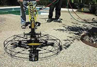 Pebble-Flex System can be smoothed with a power trowel and is a good surface near a swimming pool.