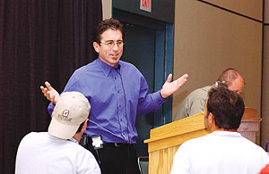 Tom Ralston addresses an enthusiastic audience at World of Concrete 2004