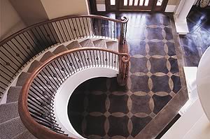 This grand entrance got an acid-stained concrete treatment to give a upscale sophisticated look to the home's entrance.