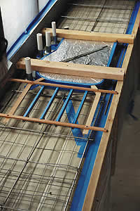 Cast in place concrete countertop form is built onsite for the proper pour.