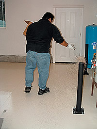 Versatile Liquid Granite Chip Flooring System - The epoxy was applied first, then the chips. Versatile recommends the broadcasting of chips to the point of rejection, laying down enough to soak into the epoxy and still leave an attractive surface afterward.