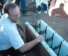 Concrete Contractor checking out an ICF block at the World of Concrete 2005