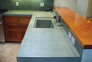 Mark Lesnick, 2nd Place - John Cox of Cox Decorative Concrete. dark sage green kitchen concrete countertops