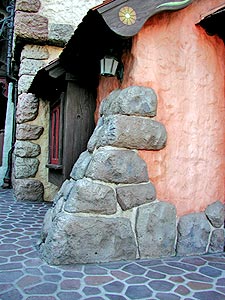 Side of building with faux concrete rock features, flintstones building