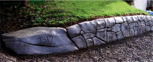 Faux Rock wall by Eric Dahl - The use of fiber reinforcement in shotcrete for faux rocks appears to be a personal choice. Some feel it adds strength. Others dont. Some say the fibers can look like fuzz on the surface if they are disturbed during the detailing stage.