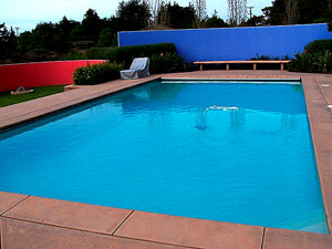 Cantilevered decks are a monolithic pour. They experience greater temperature extremes and expand and contract at a greater rate than the pool itself. A bond breaker must be used between the deck and pool or else the movement of the deck would crack the tiles of the pool. Photo courtesy of Tom Ralston Concrete
