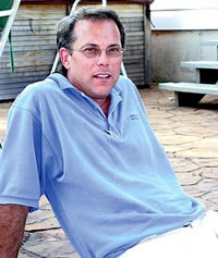 Shawn Wardall posing with his hands behind him.