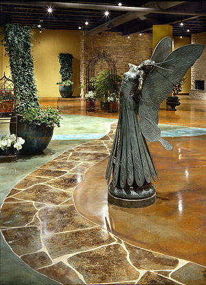 Acanthus Concrete Stain Designs - This floor design at Jacksons Home and Garden in Dallas, Texas, is made to look like a walk in a garden.