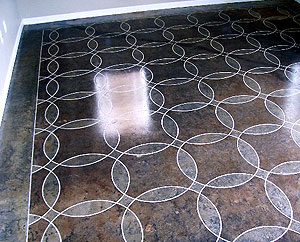 SoyCrete, a nontoxic penetrating stain, was used to color this scored floor design.
