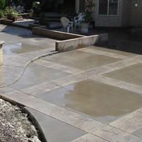 You may find you can easily wash the surface with hose pressure and get the desired finish you are looking for. Or you may find that a soft to medium broom will do the trick.