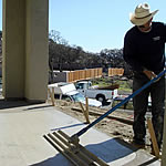 After you place the concrete, you bull-float it. (I tell my crew to make it flat every time they touch it.