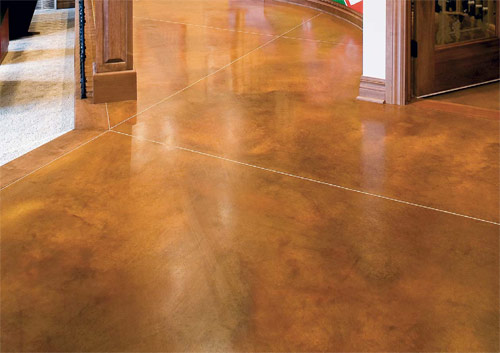This surface, colored with L.M. Scofields Lithocrome Chemstain acid stain, has a mottled and irregular appearance that is intended to closely resemble the shadings of nature. The stain allows surface imperfections to become part of the distinctive beauty of the floor.