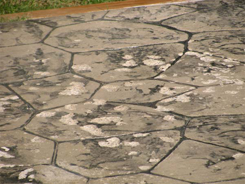 Failed concrete that was stamped and improperly sealed