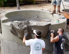 Concrete Contractors Working - Members of the Rockmolds.com crew create substrate rock shapes utilizing diamond lath that is hung, shaped to the companys specifications, and filled with a concrete mix.