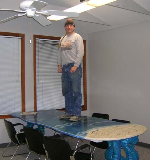 Tommy Cook of Absolute ConcreteWorks in Poulsbo, Wash., demonstrates that even though GFRC tabletops are thin, they are incredibly strong.